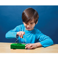 child playing with dino