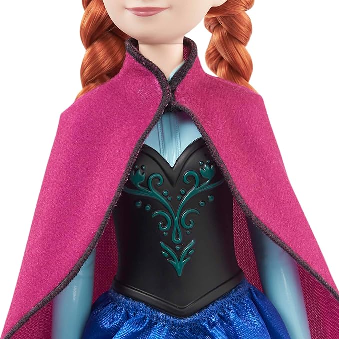 Adventure-ready Mattel Disney Anna Frozen I doll with soft cape and skirt.
