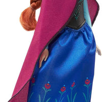 Mattel Disney Anna Frozen I doll in signature travel outfit with cape and shoes.
