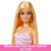 Blonde Barbie Doll with Swimsuit Beach-Themed, all set for fun under the sun, complete with summer essentials.
