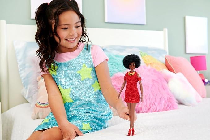 Barbie Fashionistas Doll #221 features a natural black hair look and a striking red dress, perfect for those who love fashion and collectibles.
