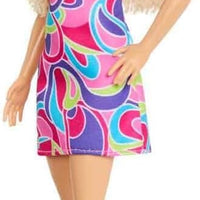 Barbie Fashionistas Doll #223, an ideal collectible for Barbie enthusiasts, comes with blonde wavy hair and a Totally Hair-inspired outfit.
