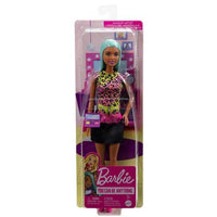 Barbie Makeup Artist Doll with Teal Hair inspires kids with her trendy outfit and hairstyling fun.
