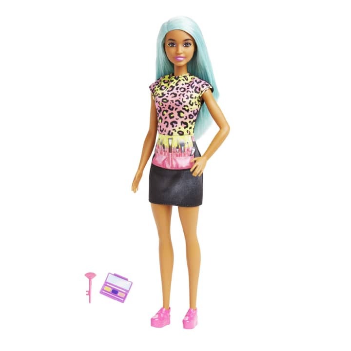 Barbie Makeup Artist Doll with Teal Hair, ready for makeovers with her stylish apron and beauty accessories.
