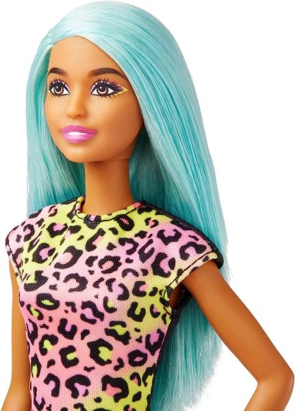 Barbie Makeup Artist Doll with Teal Hair, featuring a vibrant look and creative play accessories.
