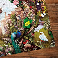 "Beautiful 1000-piece jigsaw puzzle of Haddon Hall by artist Anna Stead, with intricate butterflies and peacock designs."
