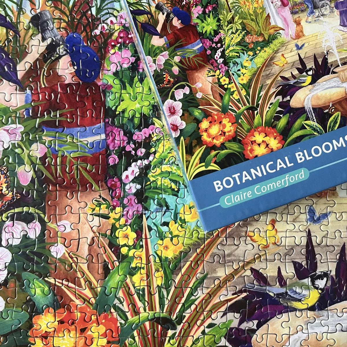 A delightful Gibsons - Botanical Blooms 1000 Piece Jigsaw Puzzle capturing a serene garden walk between a mother and daughter.
