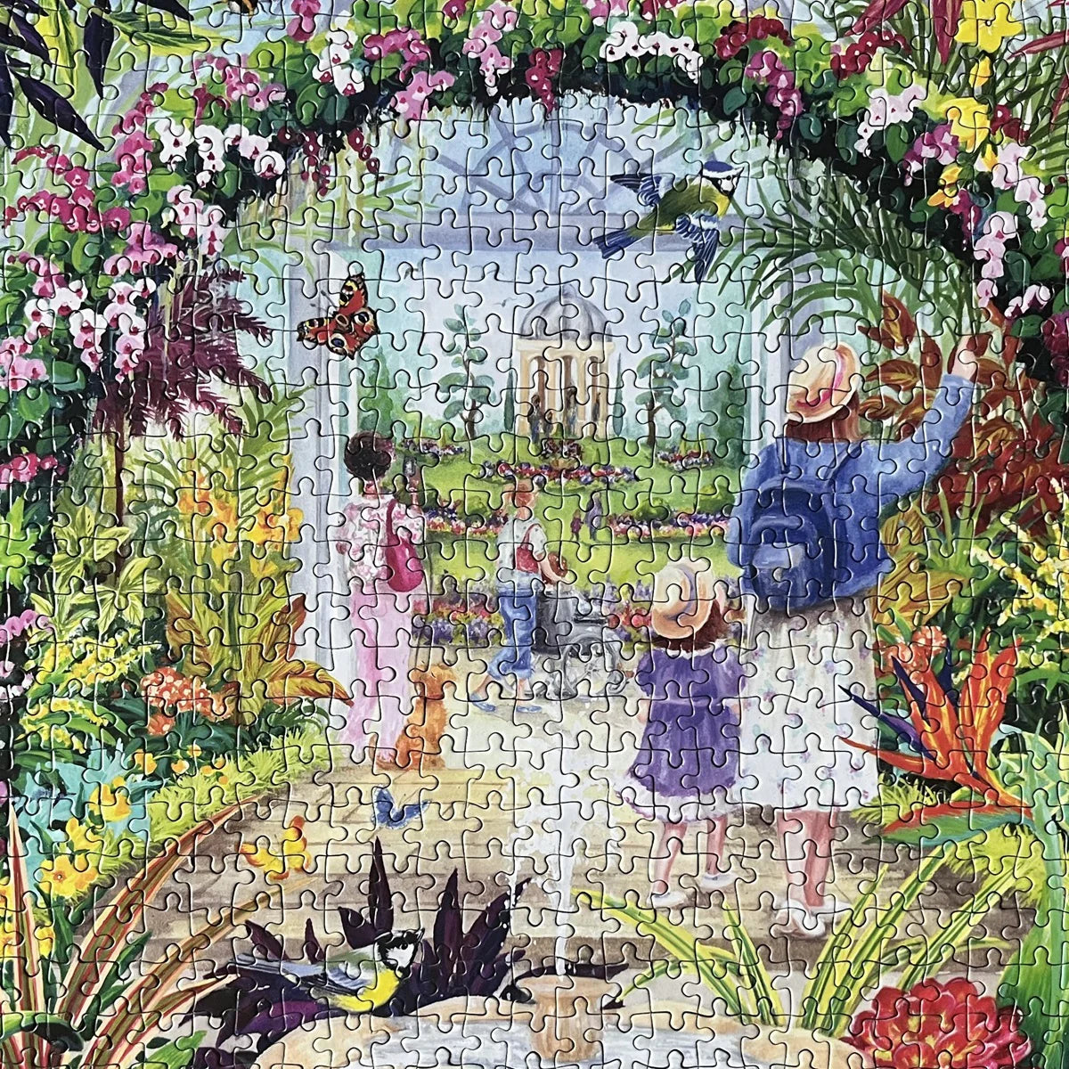 The Gibsons - Botanical Blooms 1000 Piece Jigsaw Puzzle brings to life a magical glasshouse full of greenery and feathered friends.
