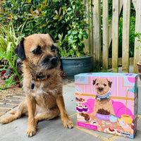 "1000-piece Nibbles with Nora jigsaw puzzle by Gibsons, featuring a charming border terrier dog inviting you to enjoy tasty treats."
