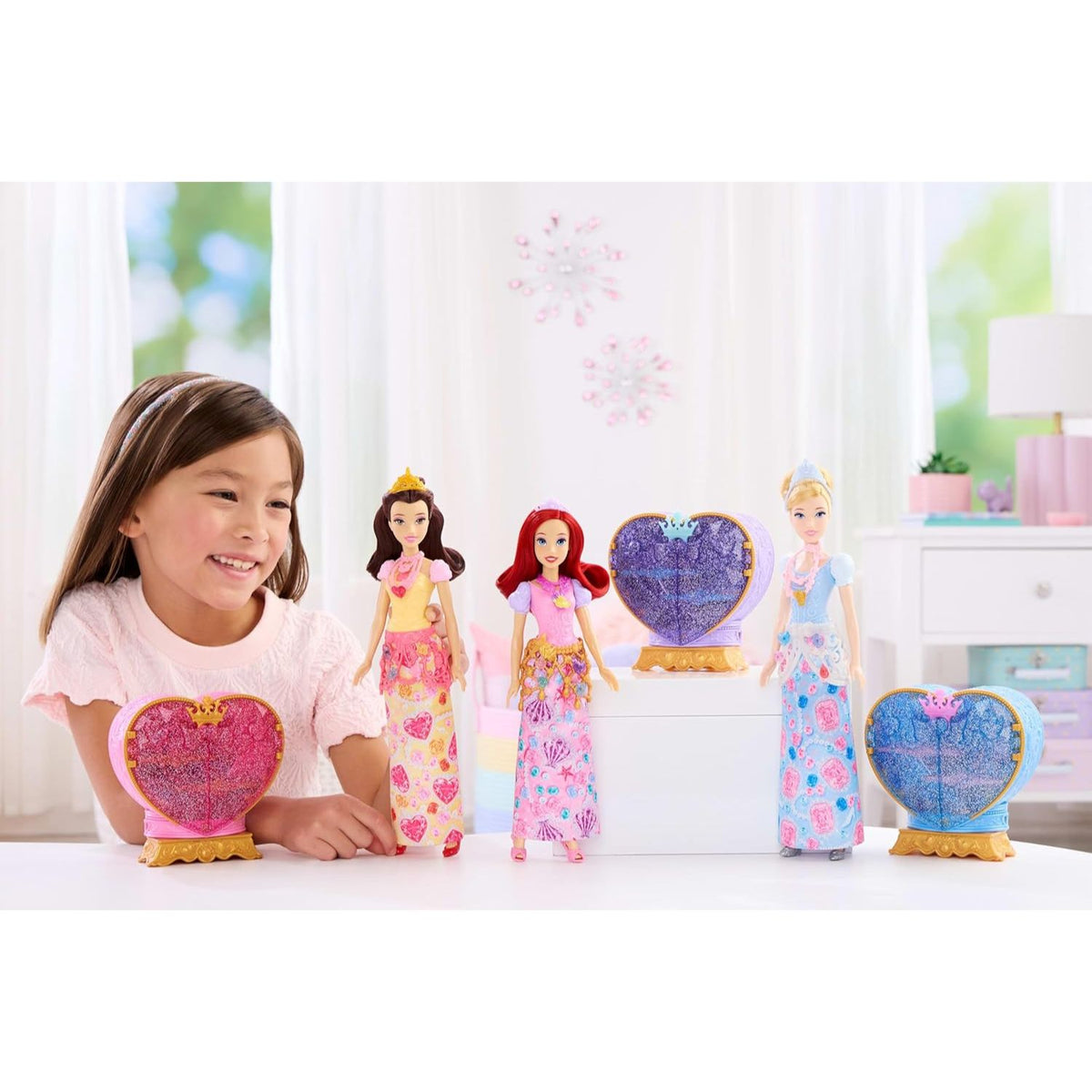girl playing with disney princess jewel reveal dolls 