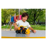 child playing with CAT truck