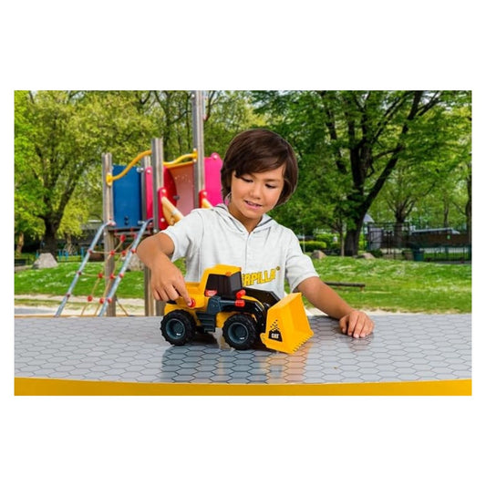 child playing with CAT truck