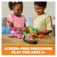 two kids playing with the Paw Patrol vehicle toys on a table.