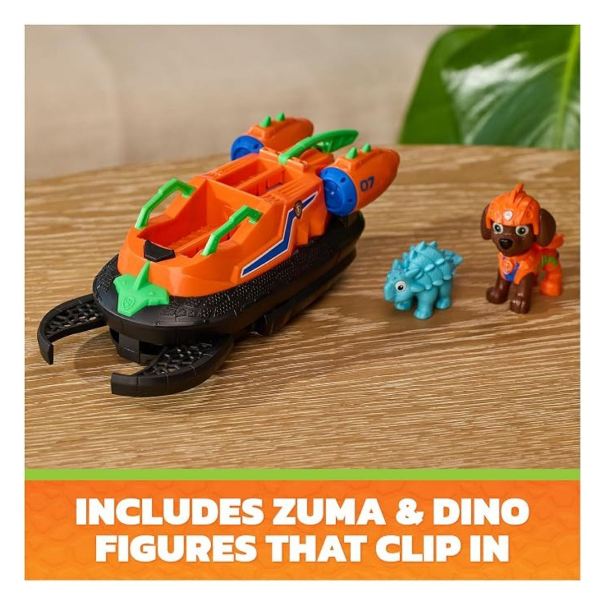 the orange hovercraft toy is on the table with the characters included.