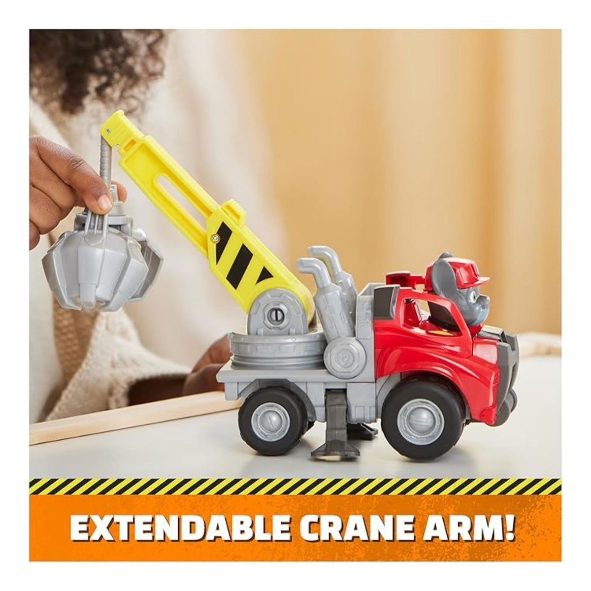 Child playing with construction vehicle toy from another angle.