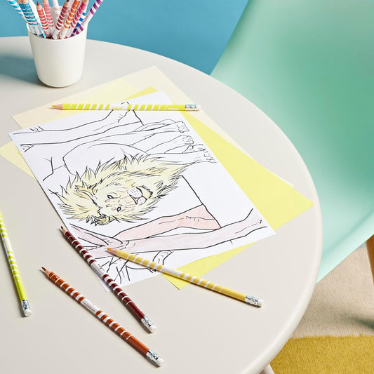 pencils scattered over lion drawing 
