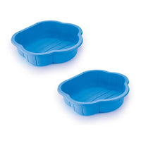 Two blue plastic sand molds on a white background
