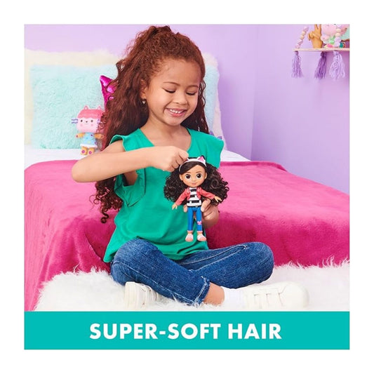 Girl playing with the doll in a bed. 