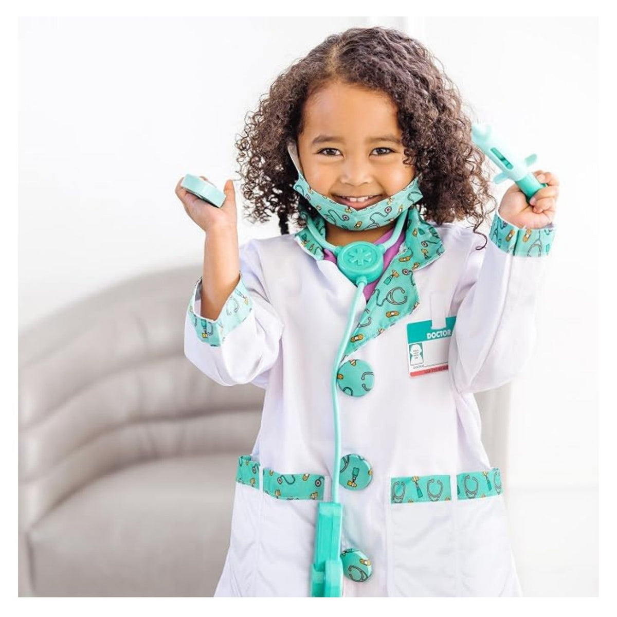 young girl playing dress up in doctor costume