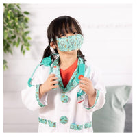 young girl playing dress up in doctor costume