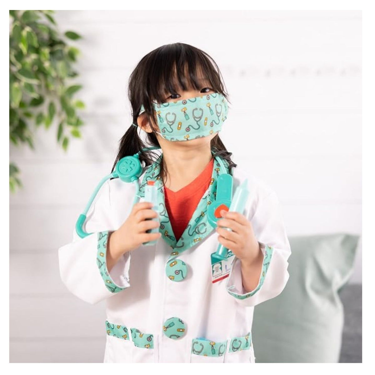 young girl playing dress up in doctor costume