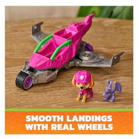 Pink vehicle with two characters sitting beside showcasing the wheels on the vehicle 