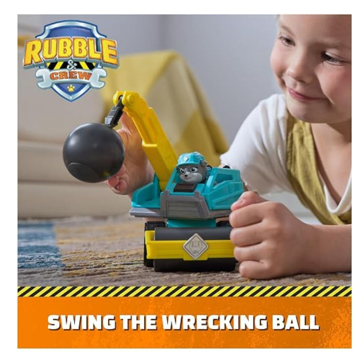 Small child playing with the construction toy on the floor.