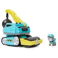 Paw patrol construction toy wrecking ball with small character figurine standing beside with a white background.