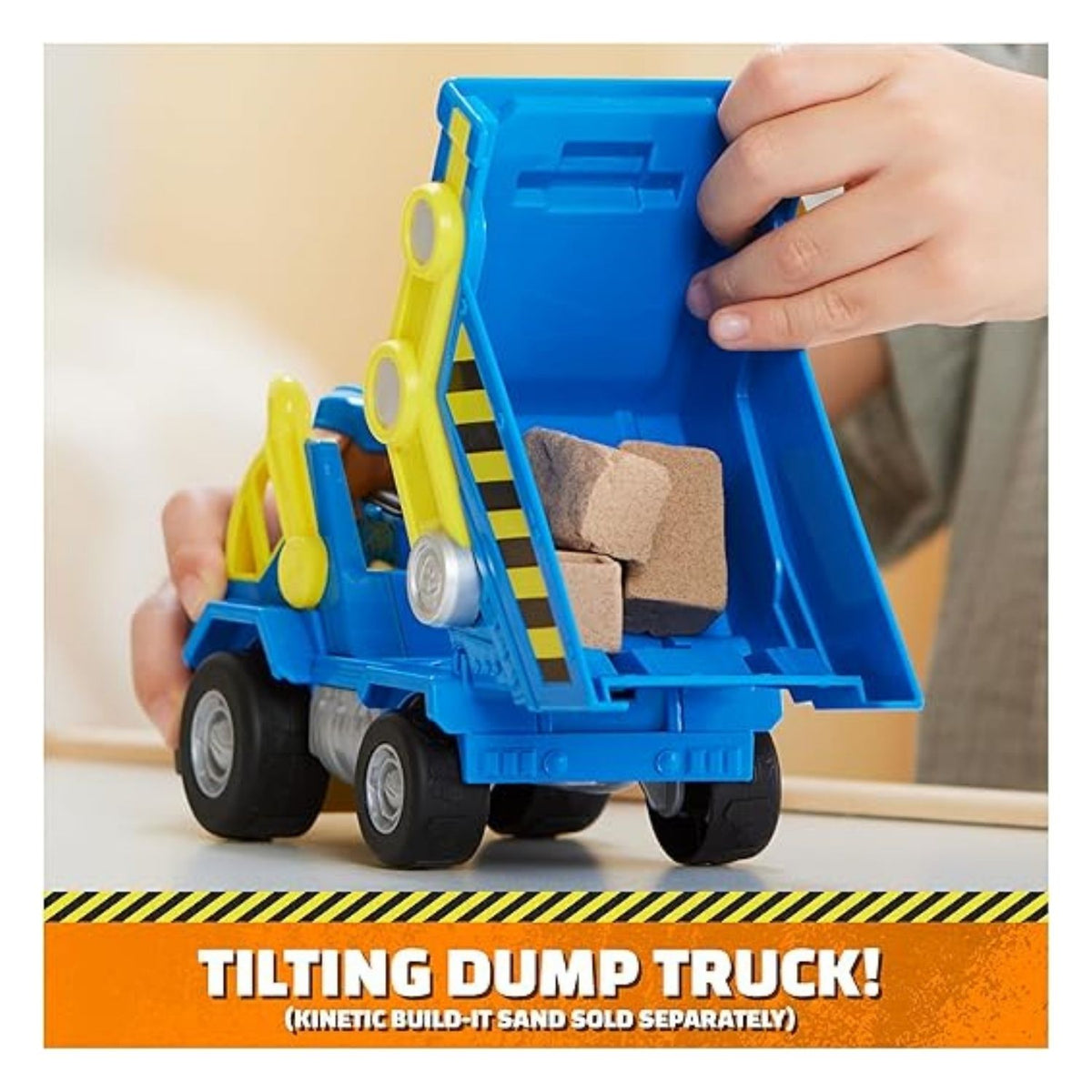 Child playing with the dump truck toy demonstrating what it can do.