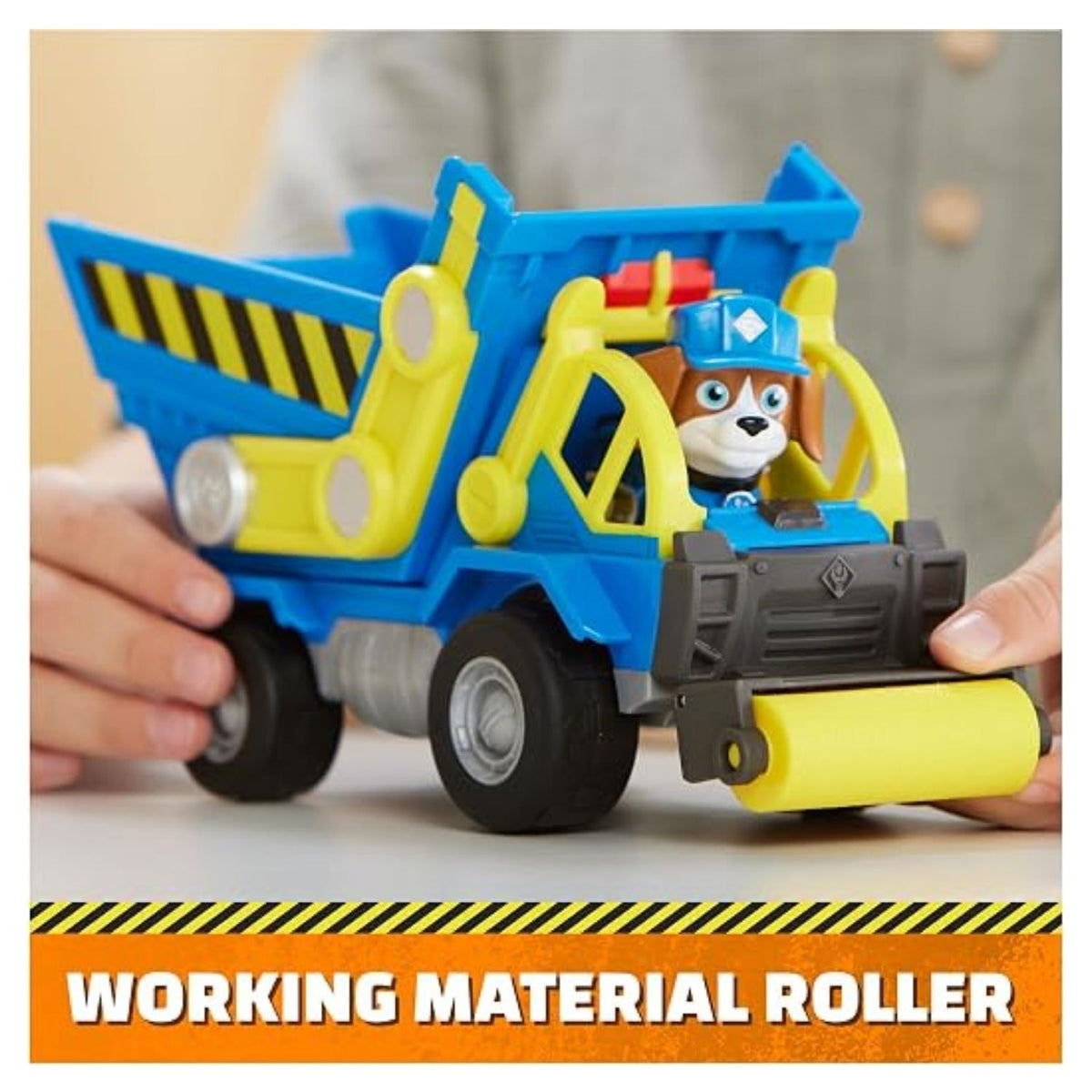 Child playing with dump truck toy at another angle with the character sitting in the front.
