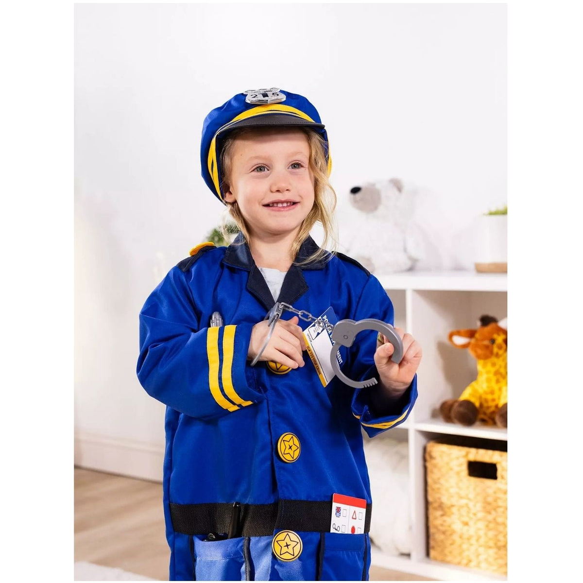 child playing dress up in a police officer costume.