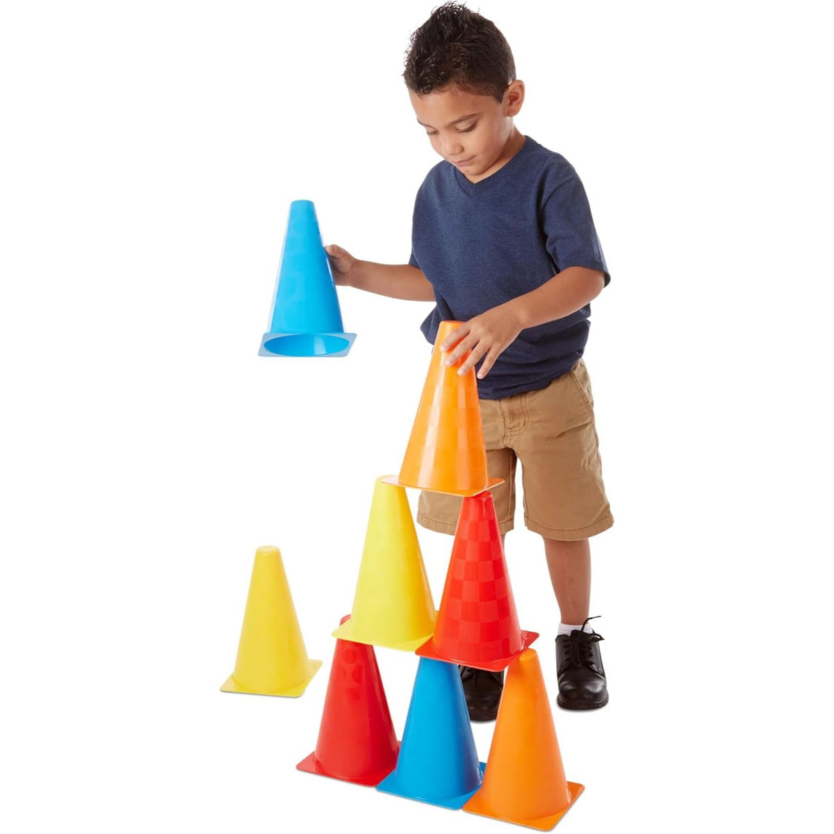 boy stacking cones 