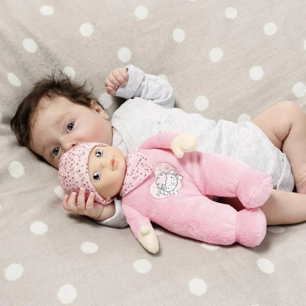 baby holding baby doll 