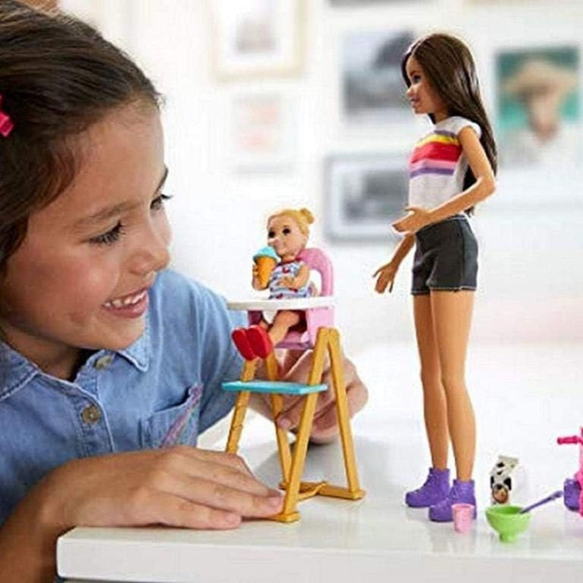 girl playing with skipper baby sitter playset 