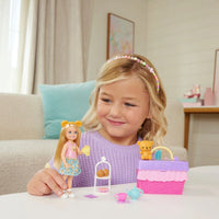 girl playing with chelsea tea party playset 