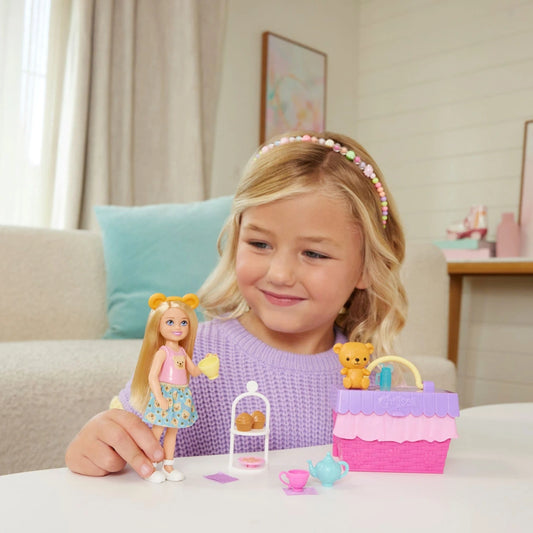 girl playing with chelsea tea party playset 