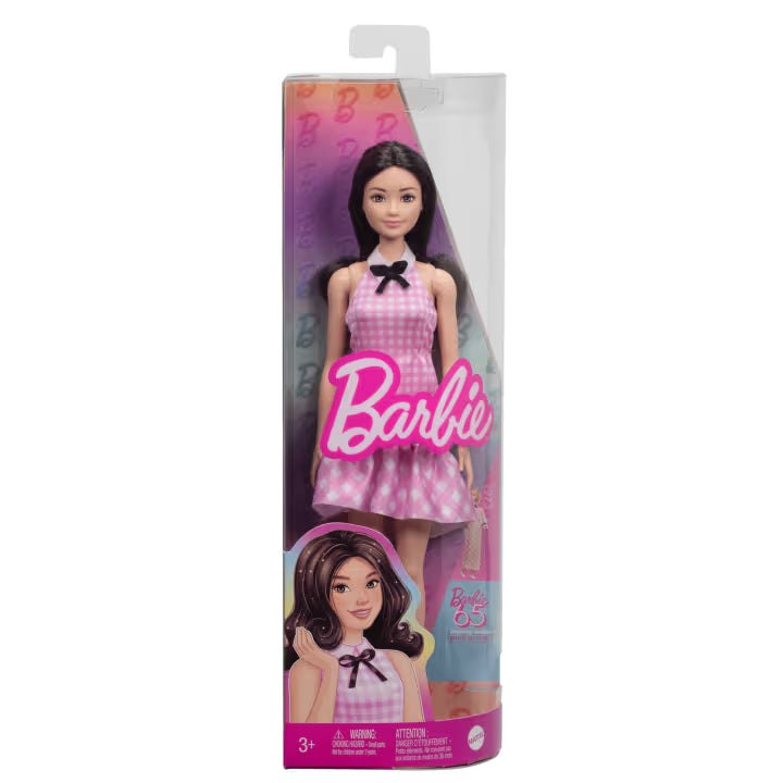black haired barbie in packaging on white background 