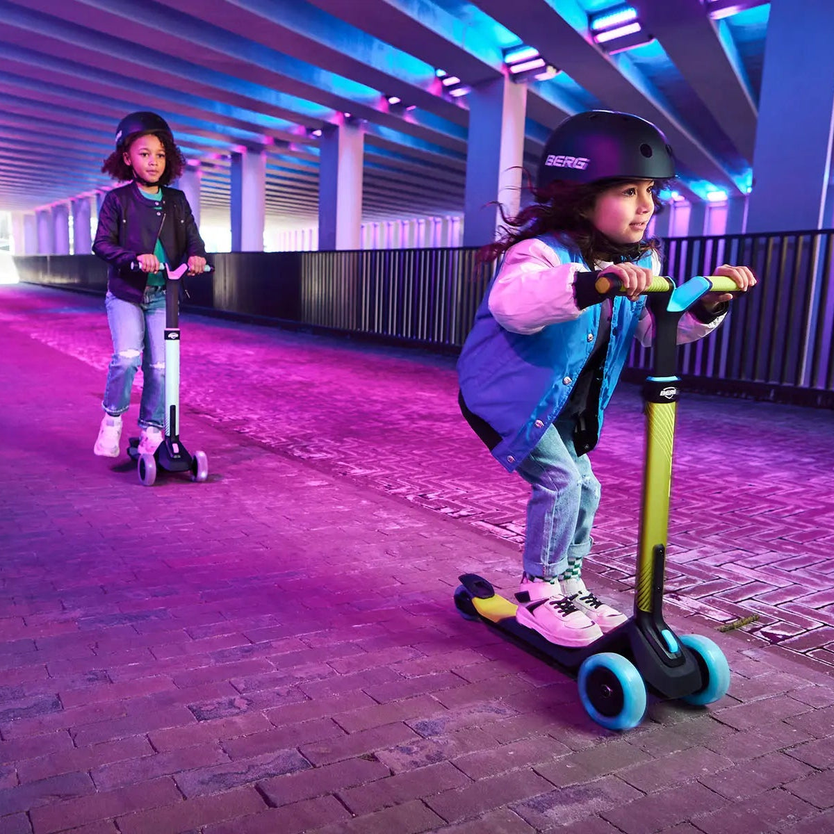children riding scooters with light up wheels 