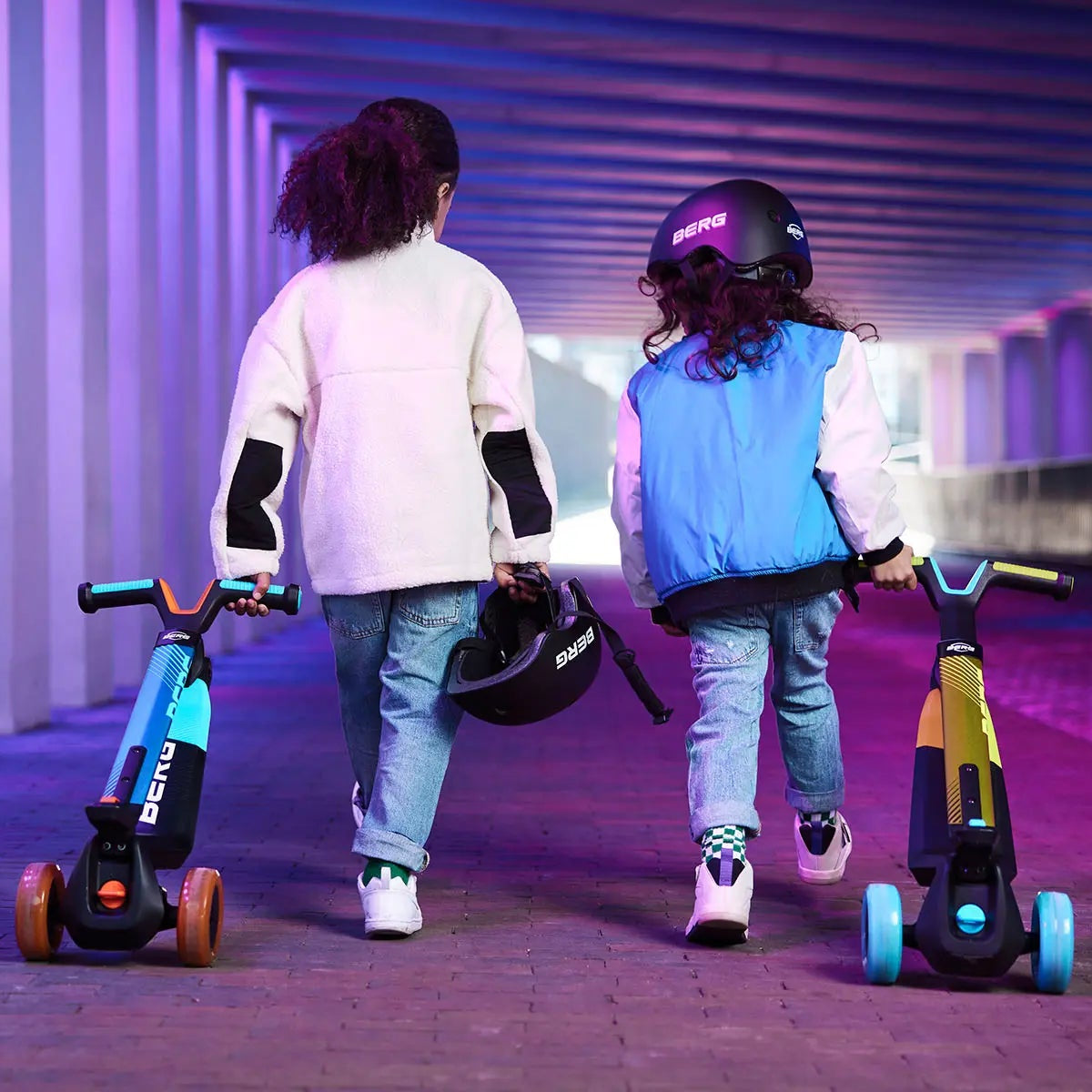 children pulling foldable scooters 