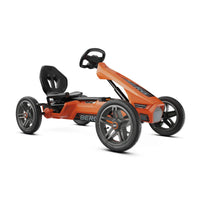 orange go-kart on white background 