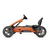 orange go-kart on white background 