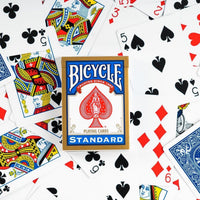 red and blue playing cards scattered around 