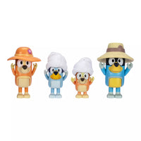 Four dog mini figures on white background 