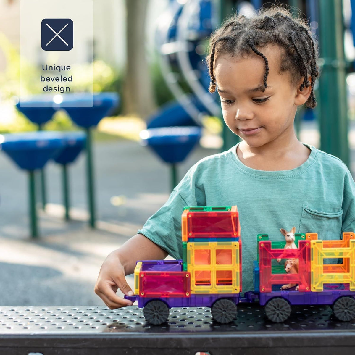 child playing with connetix transport pack 