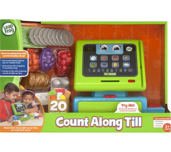 green and blue toy till in packaging on white background 