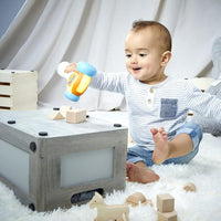 baby playing with little tikes hammer and shapes 