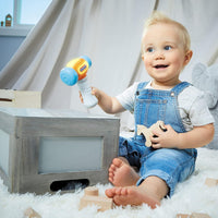 baby playing with little tikes hammer 