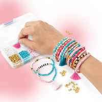 hand wearing homemade bracelets 