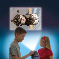 two kids using space projector 