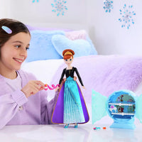 girl playing with anna disney princess doll 